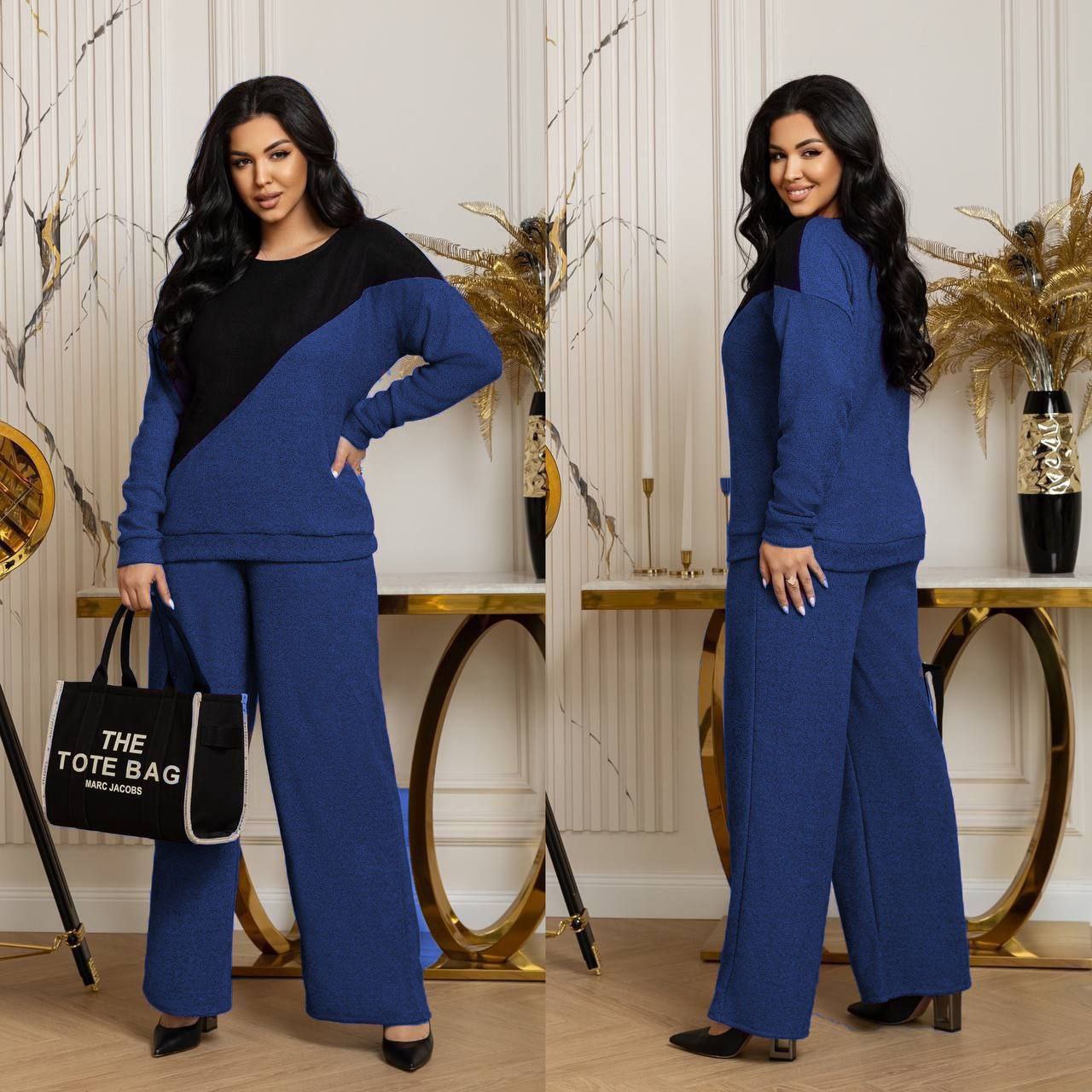 Костюм трикотаж на флісі
Костюм двійка Мод № 7672
Тканина : ангора  на флісі 
Довжина худі : 70 см..
Довжина рукава : 76 см. ( від горловини ) 
Довжина штанів : 107 см. (пояс на гумці )
Практичний стильний костюм , штани прямого покрою  , з бічними кишенями  , пояс на гумці  . Худі прямого покрою  ,з спущеним рукавом . Тканина  гарної якості , зносостійка  , приємна на дотик .
Артикул: GARNA-398346